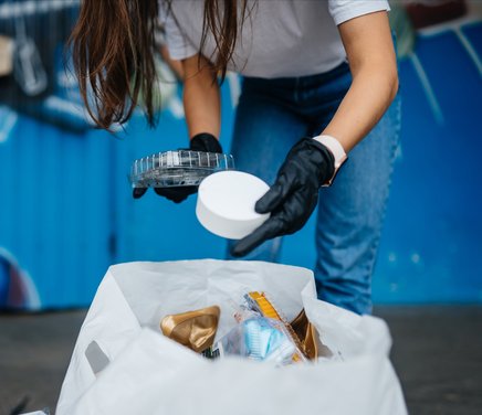 young-woman-sorting-garbage-concept-of-recycling-zero-waste.jpg